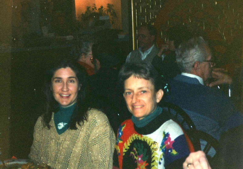 1995 Dec. 15 Staff and Board Christmas Party, Carol Tracy and Midge Saunders, trustee; Bob Davis behind her.jpg