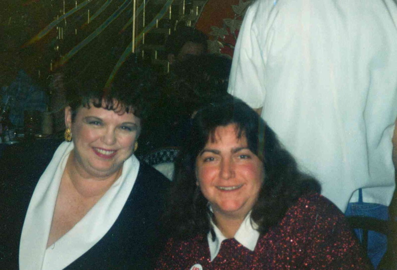 1995 Dec. 15 Staff and Board Christmas Party, Evelyn Cedzidlo of Welcome Wagon and Roxanne Long, Trustee.jpg