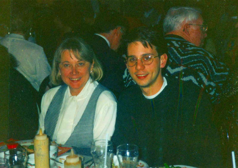 1995 Dec. 15 Staff and Board Christmas Party, Lynn Valentini, trustee, and son John.jpg