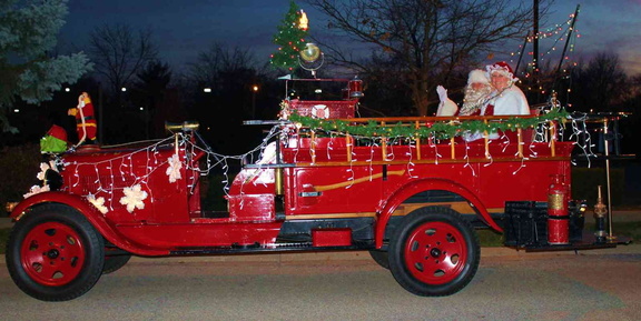 Santa and Mrs Claus on firetruck