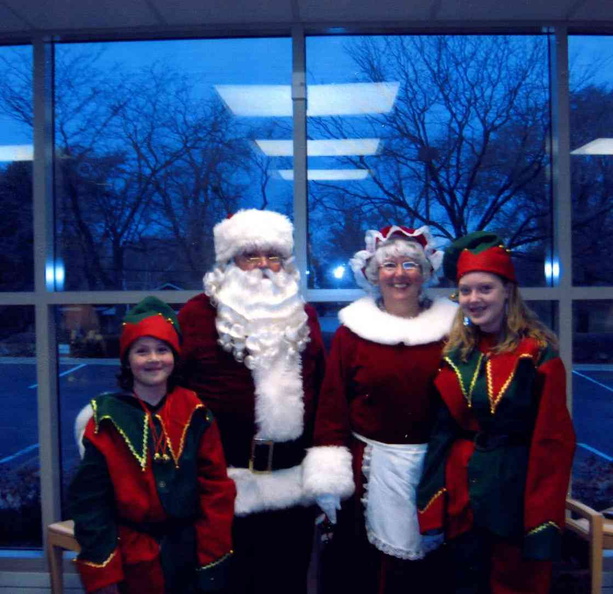 2008 Santa and Mrs Claus ready for parade, with grandkid elves.jpg