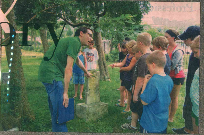 Matt Galik conducting cemetery tour newspaper photo (2).jpg