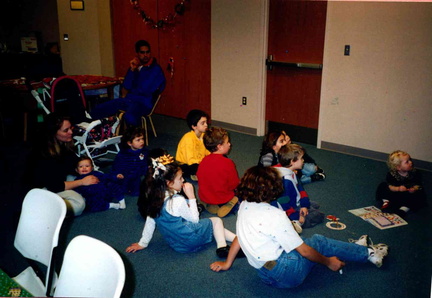 1997 Trim-the-Tree Party kids watching Rudolph